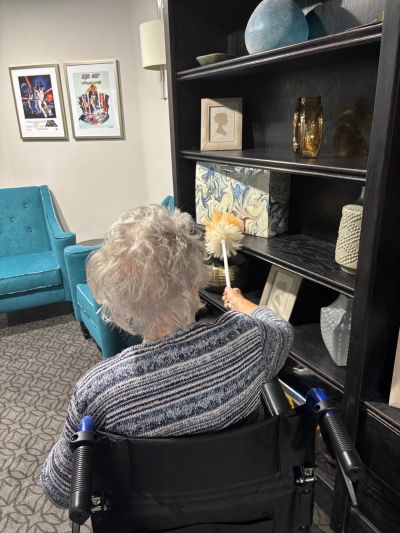 Resident's Joyful Dusting Unites Waterhouse Manor Community